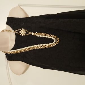 Lia Sophia long pearl necklace, with gold tone.